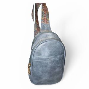 Women's faux Leather Sling Bag in Dusty Blue with Patterned Strap.